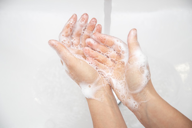 close-up-woman-is-washing-soap-foam-from-her-hands-running-water_169016-7279.jpg