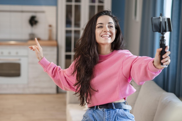 1625645597893083.jpg happy-young-blogger-using-selfie-stick-talking-phone_23-2148538872.jpg